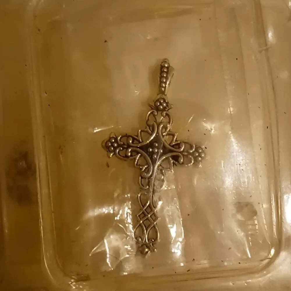 1 gold bracelet with cross charm